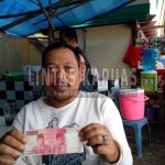 Boy(36), pedagang yang menemukan uang palsu Di Pameran